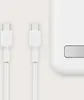 Two white USB-C cables are shown next to a white electronic device. Voir les images du produit