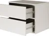 A white, two-drawer nightstand with one drawer slightly ajar, showing the interior and drawer slides. Produktbild-Vorschau