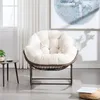 A comfortable-looking chair with a plush cushion sits in a well-lit room with sheer curtains and a large piece of abstract art on the wall. Anteprima dell’immagine prodotto