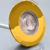A close-up studio shot of a gold LED recessed light fixture against a light gray background. Produktbild-Vorschau