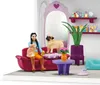 A dollhouse-style playset depicting a pet grooming salon with a girl, a cat, a dog, and various accessories. Produktbild-Vorschau