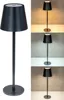 A black LED table lamp is shown in a studio setting with different lighting conditions. Produktbild-Vorschau