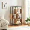 A modern living room with a bookshelf filled with decorative items and books, next to a sofa. Náhled obrázku produktu