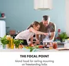 A father and daughter are cooking in a kitchen with a range hood above them. Náhľad obrázku produktu