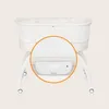 A close-up view of the control panel and mesh fabric of a baby bassinet. Anteprima dell’immagine prodotto
