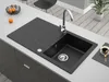 A black granite kitchen sink with a silver faucet is installed on a light gray countertop. Náhľad obrázku produktu