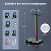 A product image showcasing a headphone stand with integrated wireless charging and RGB lighting, alongside smaller images of various headphones. Podgląd zdjęcia produktu