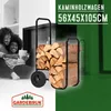 A couple is sitting on the floor in front of a fireplace, looking at a tablet. A firewood cart filled with logs is positioned next to them. Anteprima dell’immagine prodotto