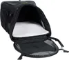 An open black pet carrier with a white fluffy cushion inside. Produktbild-Vorschau