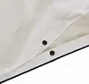 A close-up view of white fabric with two black snap fasteners and a dark blue trim. Produktbild-Vorschau