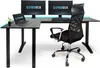 A black L-shaped gaming desk with two monitors, a laptop, a keyboard, and a chair, set against a white background with subtle blue LED lighting. Anteprima dell’immagine prodotto