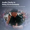 A security guard using a walkie-talkie in a crowded environment. Voir les images du produit