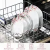 A set of white plates with pink floral designs are neatly arranged in a dishwasher rack. Produktbild-Vorschau