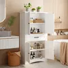 A bright and airy bathroom with a white cabinet filled with toiletries, next to a bathtub and sink. Voir les images du produit