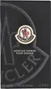 A black box with the Moncler logo and product details. Voir les images du produit