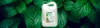 A bottle of dish soap is placed in front of a background of green leaves. Náhled obrázku produktu