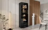 A modern living room with a tall, black, high-gloss display cabinet with LED lighting, showcasing decorative items. A tall, textured floor lamp stands to the left, and a white bust on a pedestal is to the right. Anteprima dell’immagine prodotto