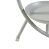 A close-up view of the base and lower part of a light gray metal plant stand. Podgląd zdjęcia produktu