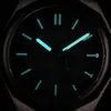 A close-up view of a Citizen watch face in low light, with luminous hands and markers. Podgląd zdjęcia produktu