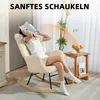 A woman is relaxing in a beige corduroy rocking chair, reading a book. A small wooden side table with a fruit bowl and a cup is next to the chair. The background features sheer curtains and a tall plant. Produktbild-Vorschau