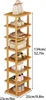 A multi-tiered wooden shoe rack filled with various shoes and a handbag. Produktbild-Vorschau