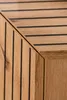 A close-up view of the corner of a wooden furniture piece with a slatted design. Anteprima dell’immagine prodotto