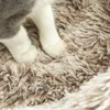 Close-up of a cat's paws resting on a fluffy brown surface. Podgląd zdjęcia produktu