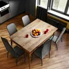 A dining table with chairs and a fruit bowl in a modern room. Produktbild-Vorschau