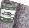 A rolled-up mat with flower meadow seeds embedded in it, with a label attached. Produktbild-Vorschau