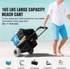 A man pulls a beach cart loaded with gear on a sandy beach. Produktbild-Vorschau