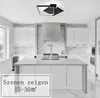 A modern kitchen with white cabinets, a stainless steel range hood, and a large island. A contemporary ceiling light fixture is visible. Produktbild-Vorschau