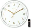 A white analog clock with gold hands and numbers, shown with a battery. Podgląd zdjęcia produktu