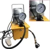 A yellow and silver electric hydraulic pump with a black hose and foot pedal, set against a white background. Podgląd zdjęcia produktu