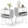 Two white nightstands with open shelves and drawers, displayed against a white background. Náhled obrázku produktu