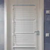 A white drying rack is mounted on a white door. Produktbild-Vorschau