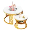 A set of two nesting coffee tables with white marble-effect tops and gold metal bases, presented on a white background. Produktbild-Vorschau