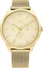 A close-up studio shot of a gold Tommy Hilfiger watch with a cream-colored dial and a mesh band. Produktbild-Vorschau