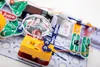 A close-up view of an electronic building kit with various components connected on a white surface. Produktbild-Vorschau