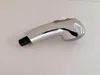 A single chrome-finished shower head with a black connector, lying on a plain white background. Produktbild-Vorschau