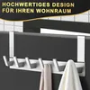 An over-the-door hook rack with multiple hooks, holding two towels. The image has a marketing overlay with text. Produktbild-Vorschau