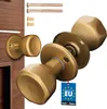 A set of gold-colored door knobs and mounting hardware, with a 'Made in EU' tag. Produktbild-Vorschau