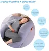 A pregnant woman is lying on a U-shaped pillow. Náhled obrázku produktu
