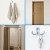 A collage of four images related to hooks and storage, including towels on a hook, a door with hooks, a changing room, and a hook with keys. Produktbild-Vorschau