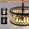 A close-up of a crystal chandelier with a comparison graphic on the left. Voir les images du produit