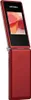 A red flip phone is shown from a side angle against a white background. Náhľad obrázku produktu