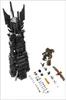 A Lego set featuring a tall black tower and several smaller Lego pieces, including a tree-like figure and a bird. Produktbild-Vorschau