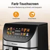 A close-up of the top of a black and silver air fryer with a digital display showing food images and time. Produktbild-Vorschau