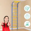 A young girl gives a thumbs up in front of a home gym climbing frame. Voir les images du produit