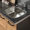A close-up view of a kitchen sink and countertop. Náhled obrázku produktu