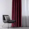 A chair with a pillow next to a curtain. Produktbild-Vorschau